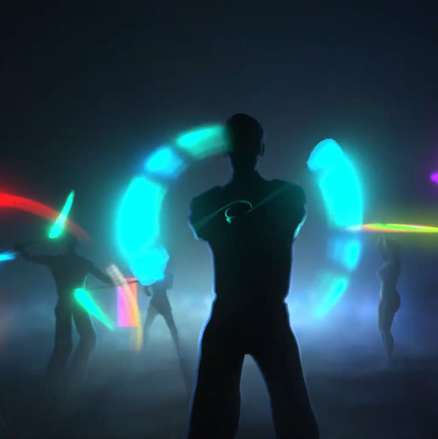 a darkened room full of people spinning brilliant glow props